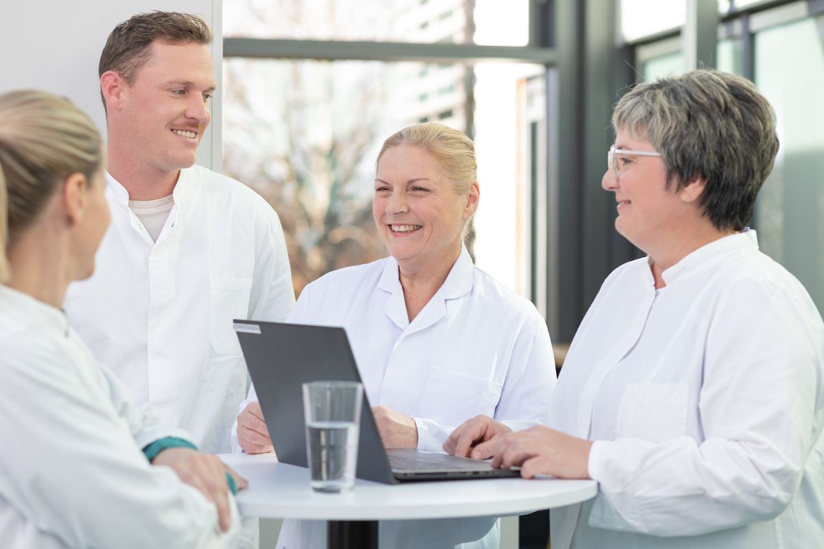 AMW employees in conversation