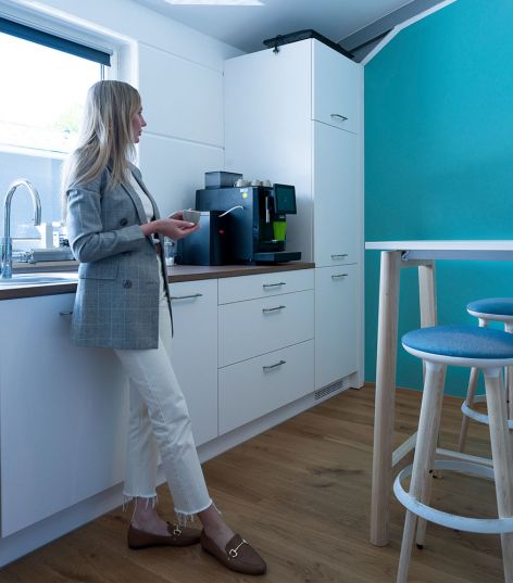 Employee in the break room at AMW in Warngau