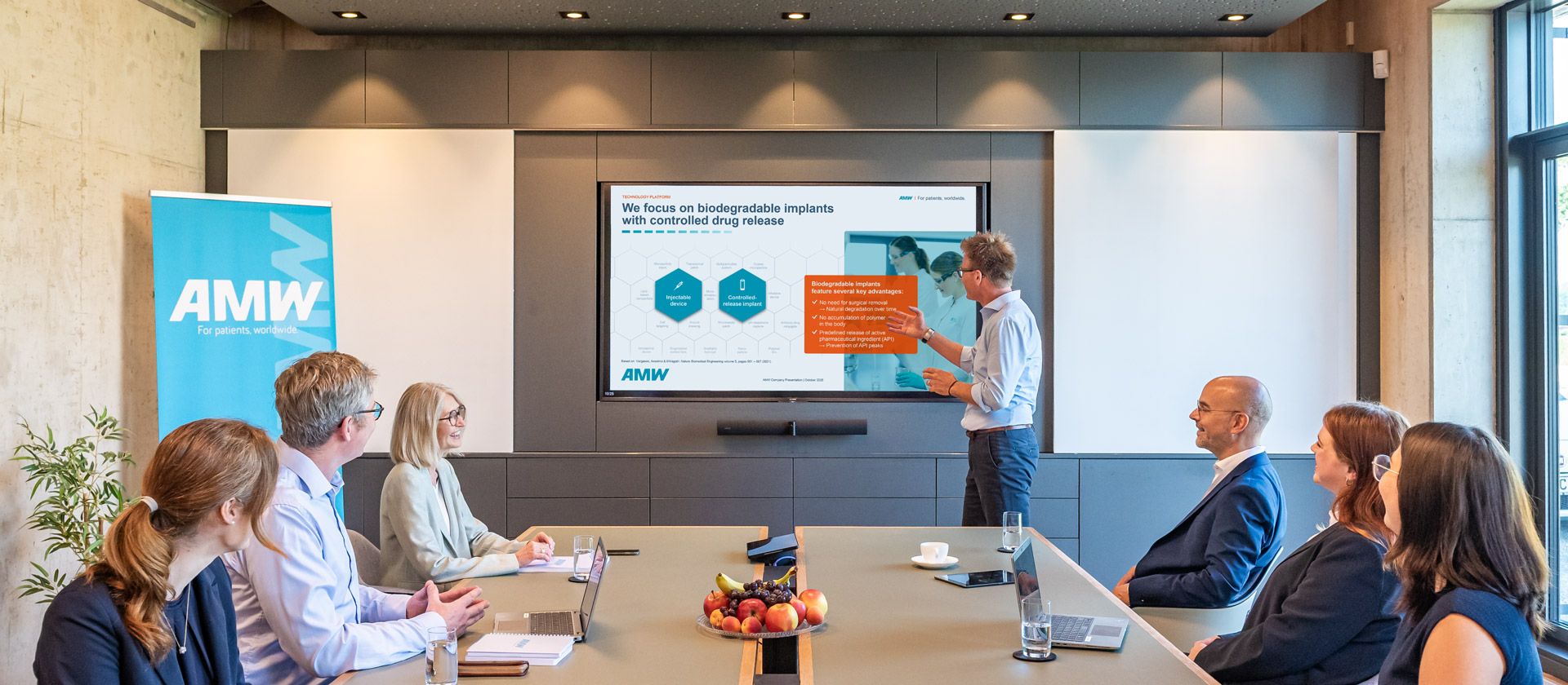 AMW employees at a meeting in the meeting room